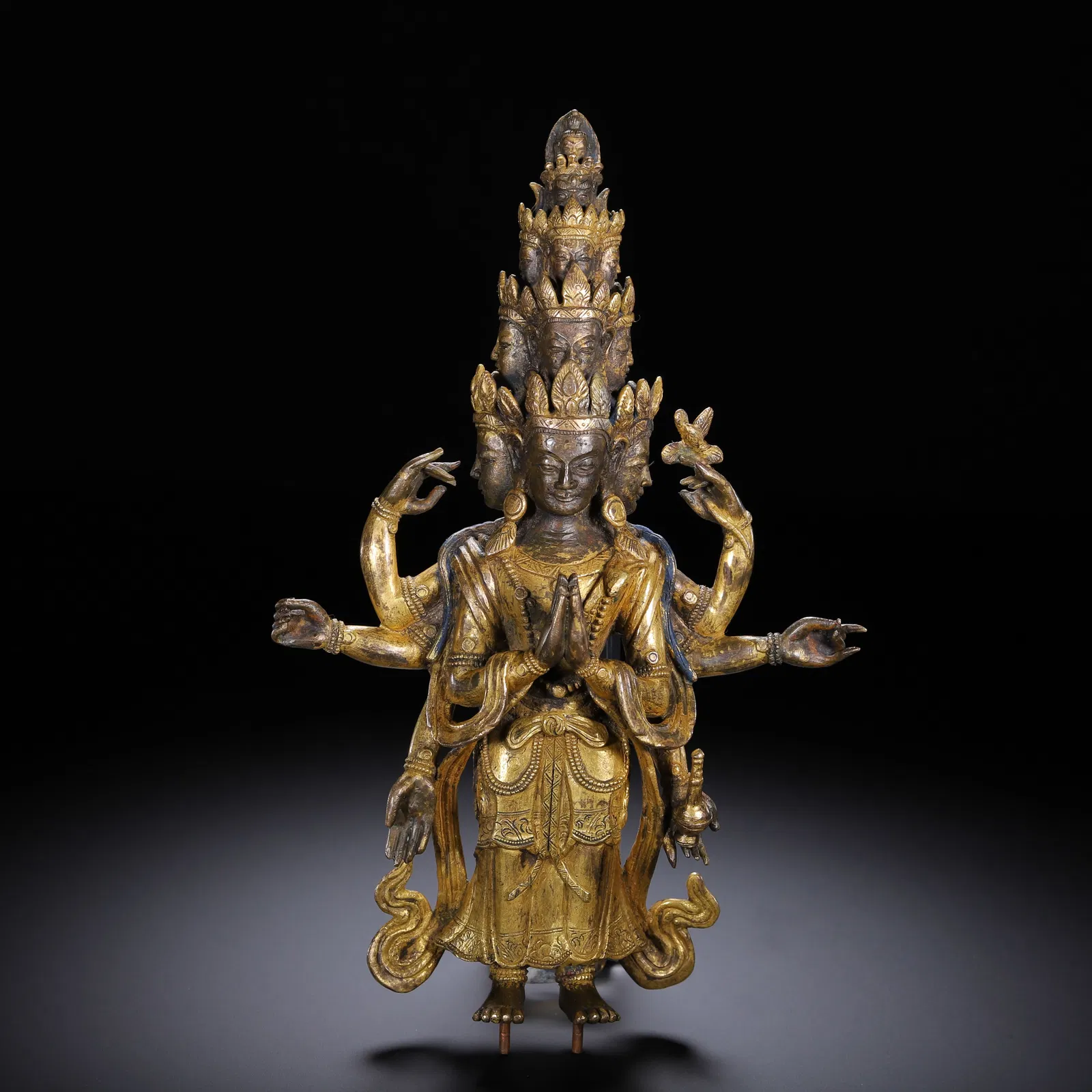A CHINESE GILT-BRONZE ELEVEN-HEADED GUANYIN