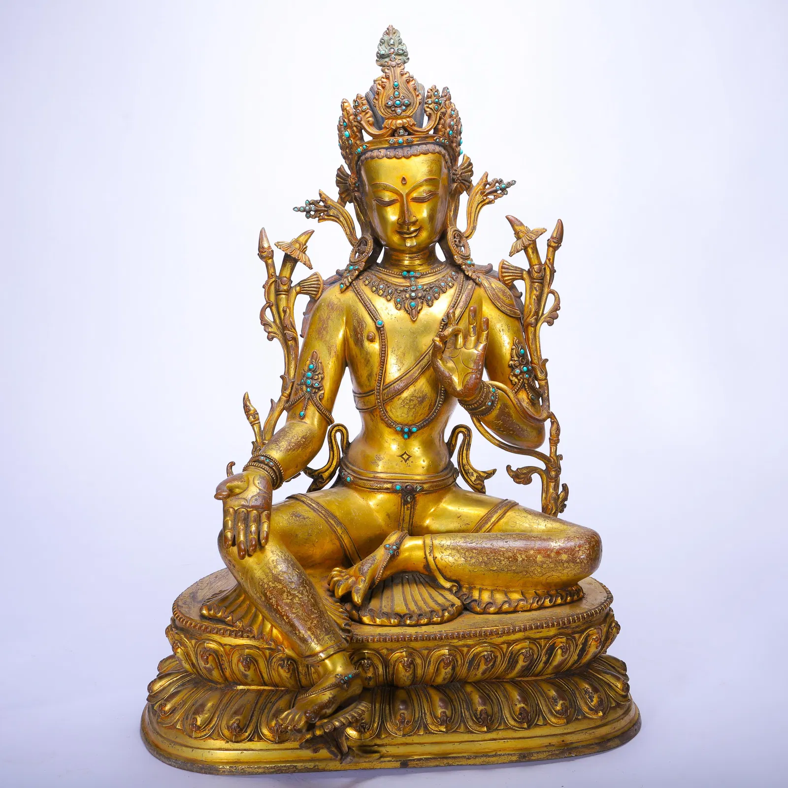 A CHINESE GILT-BRONZE GREEN TARA FIGURE