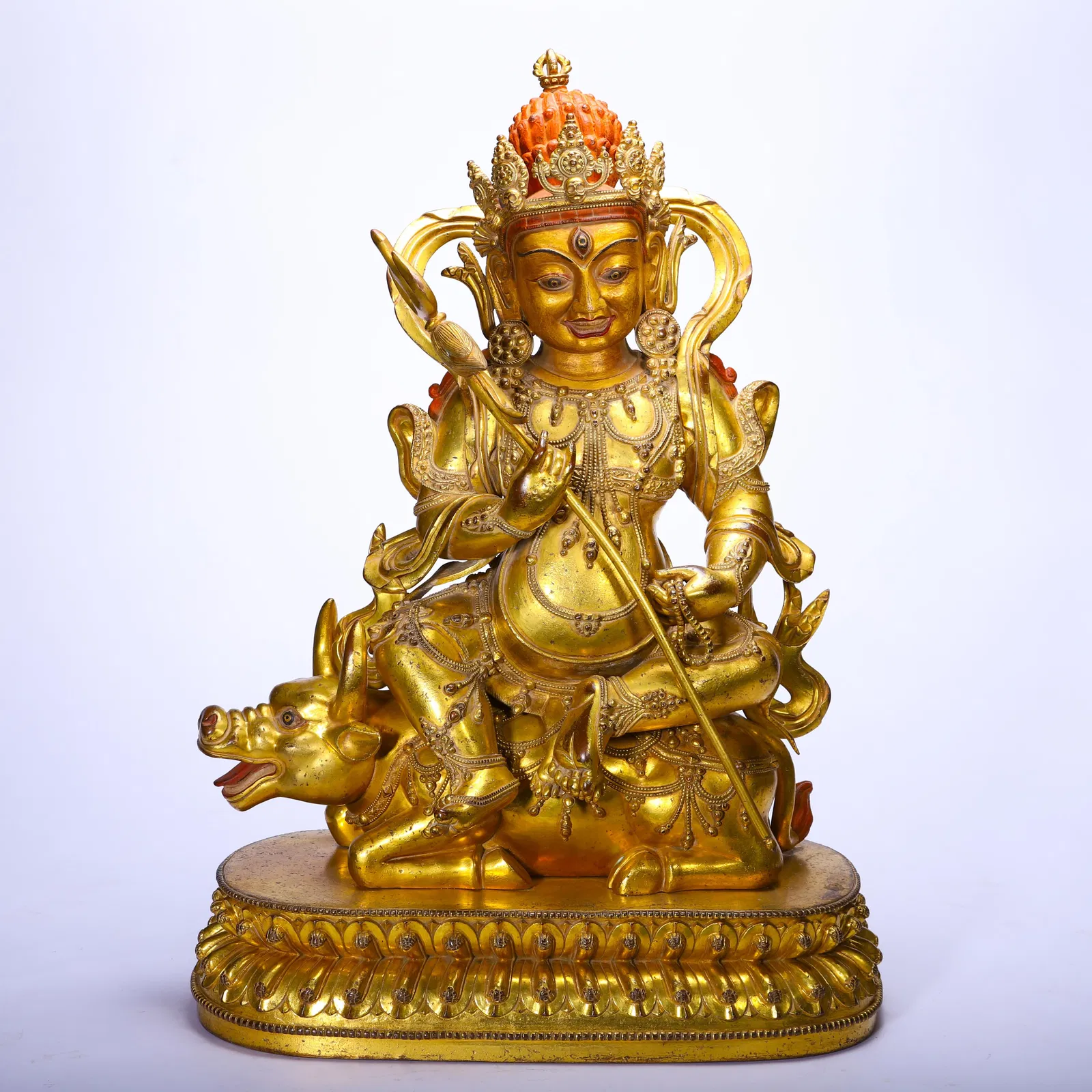 A CHINESE GILT-BRONZE JAMBHALA FIGURE