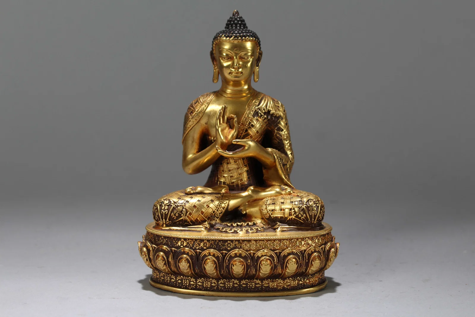 A Chinese Gilt Vividly-detailed Religious Fortune Buddha Statue