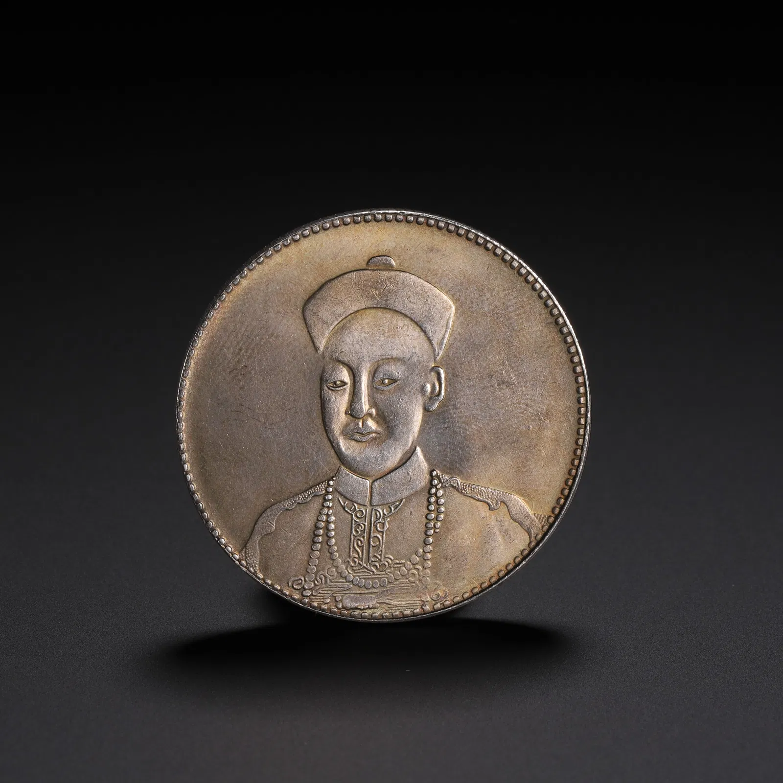 A CHINESE SILVER COIN