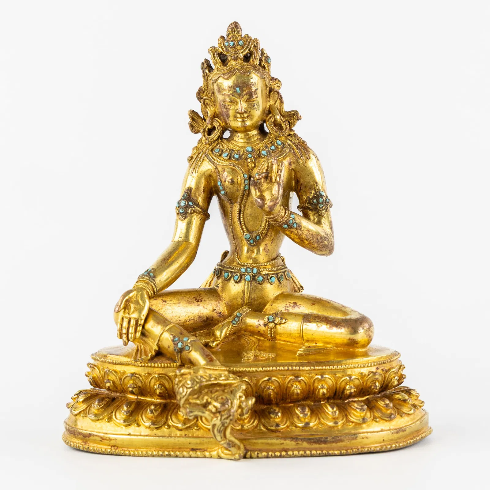 A Chinese Tara Buddha, gilded bronze and turquoise inlay. 18th/19th C.