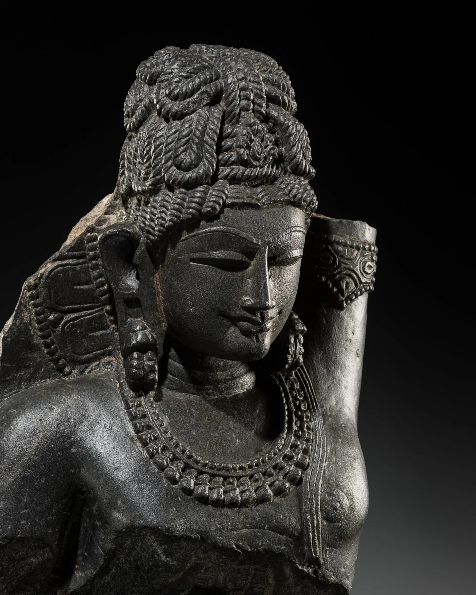 A CHLORITIC SCHIST FRAGMENT OF KRISHNA LIFTING MOUNT GOVARDHAN, HOYSALA DYNASTY (1000-1346),