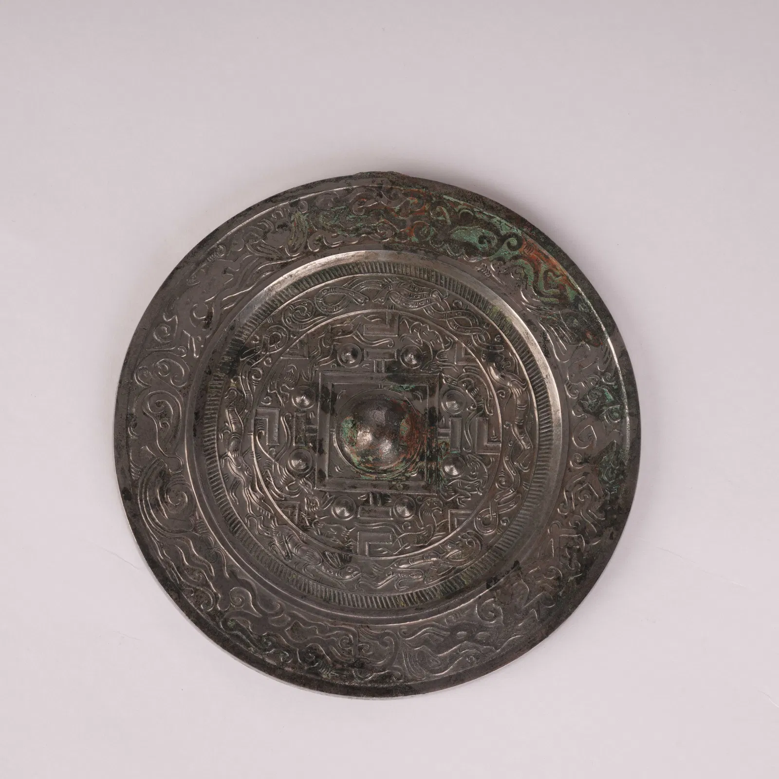 A CIRCULAR BRONZE MIRROR WITH STANDARD PATTERN, HAN DYNASTY