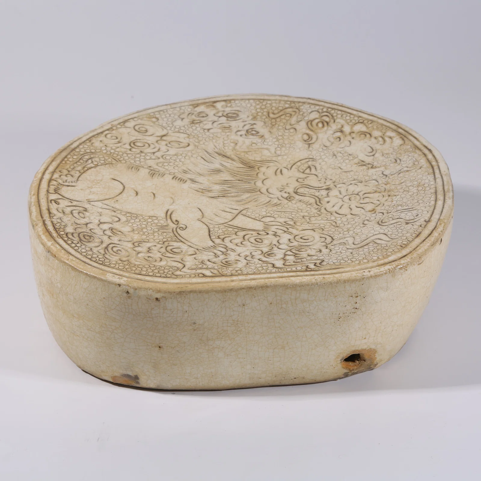 A CIZHOU KILN PILLOW WITH AUSPICIOUS BEAST PATTERN