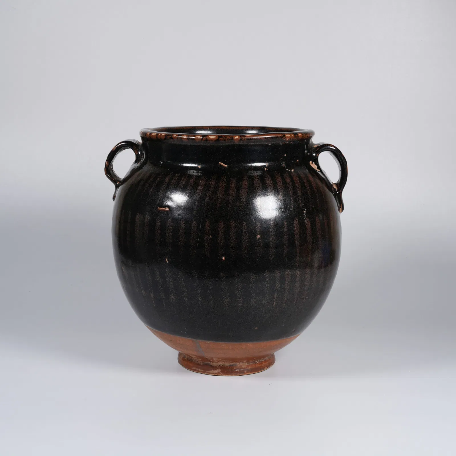 A CIZHOU WARE TWIN-HANDLED JAR