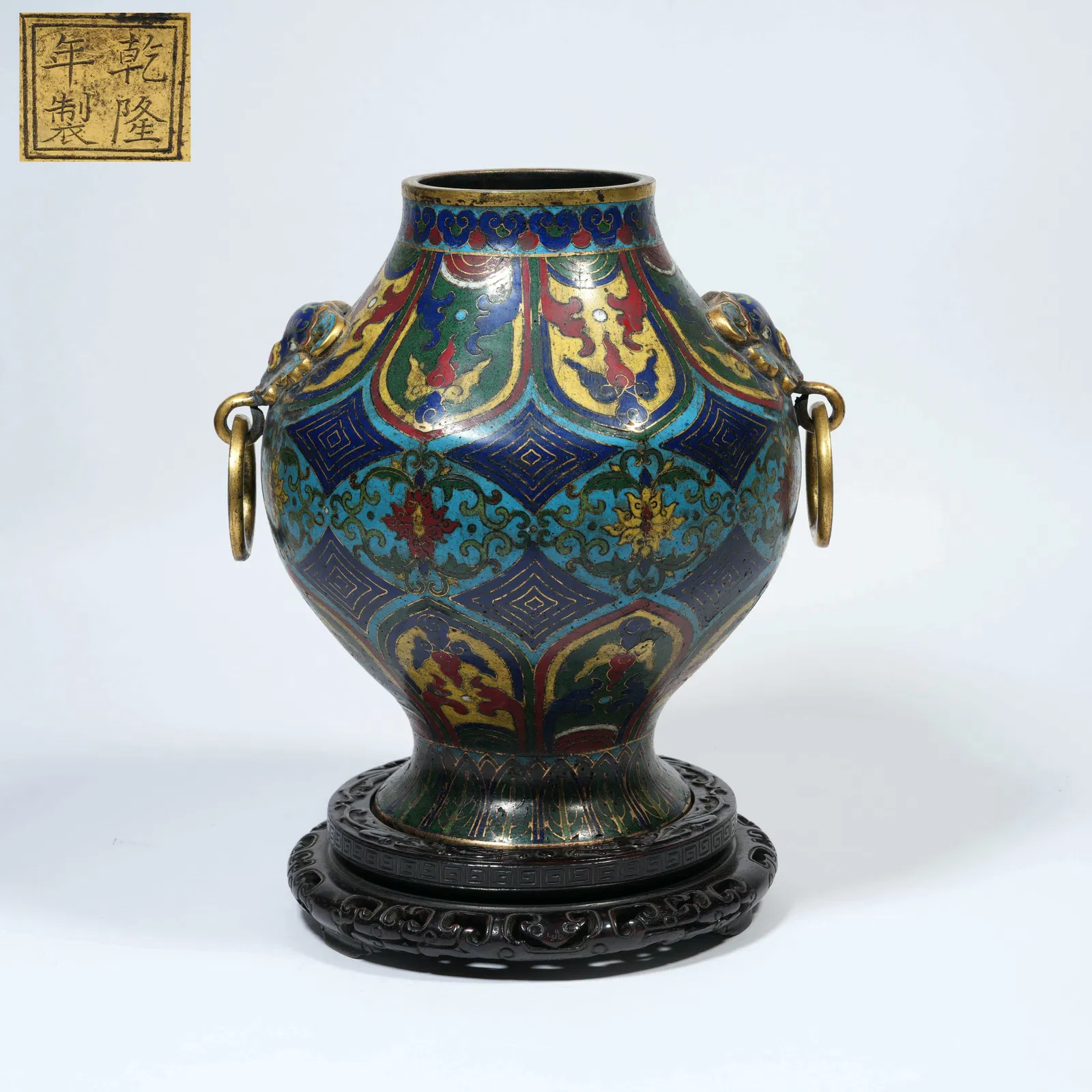 A CLOISONNÉ-ENAMEL DOUBLE-BEAST-HANDLED JAR WITH INTERTWINING FLORAL MOTIFS ON A BRONZE BODY