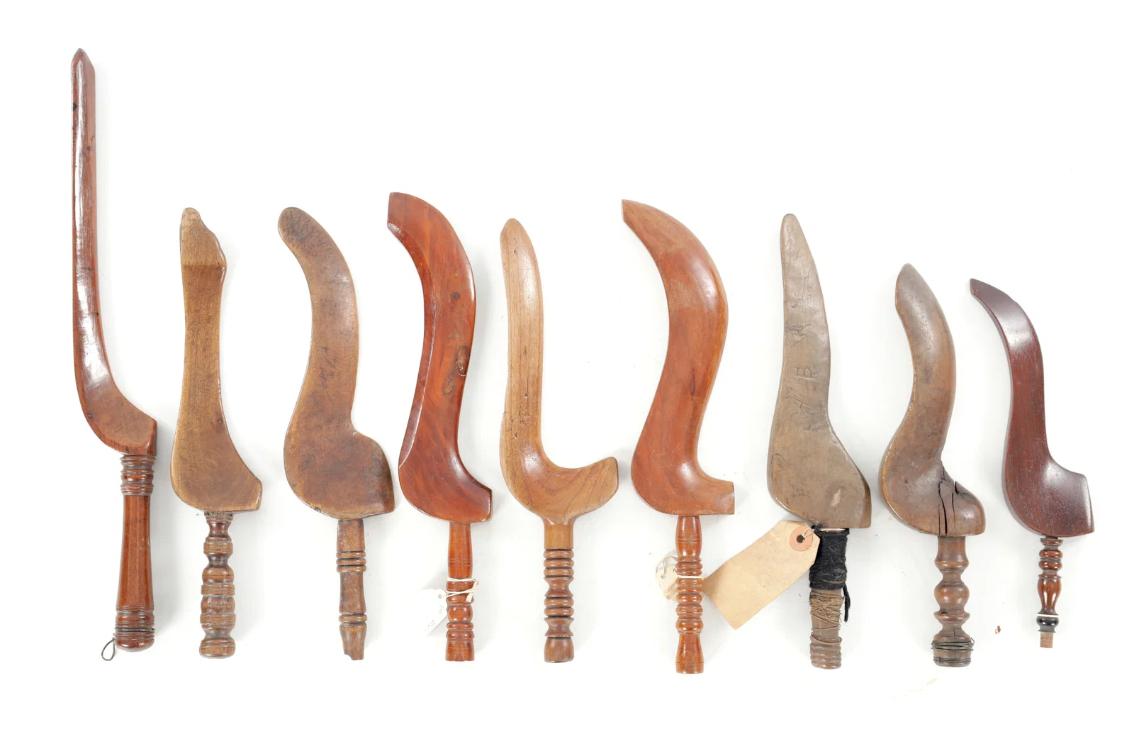 A COLLECTION OF 19TH AND EARLY 20TH CENTURY CARVED WOOD KNITTING SHEATHS