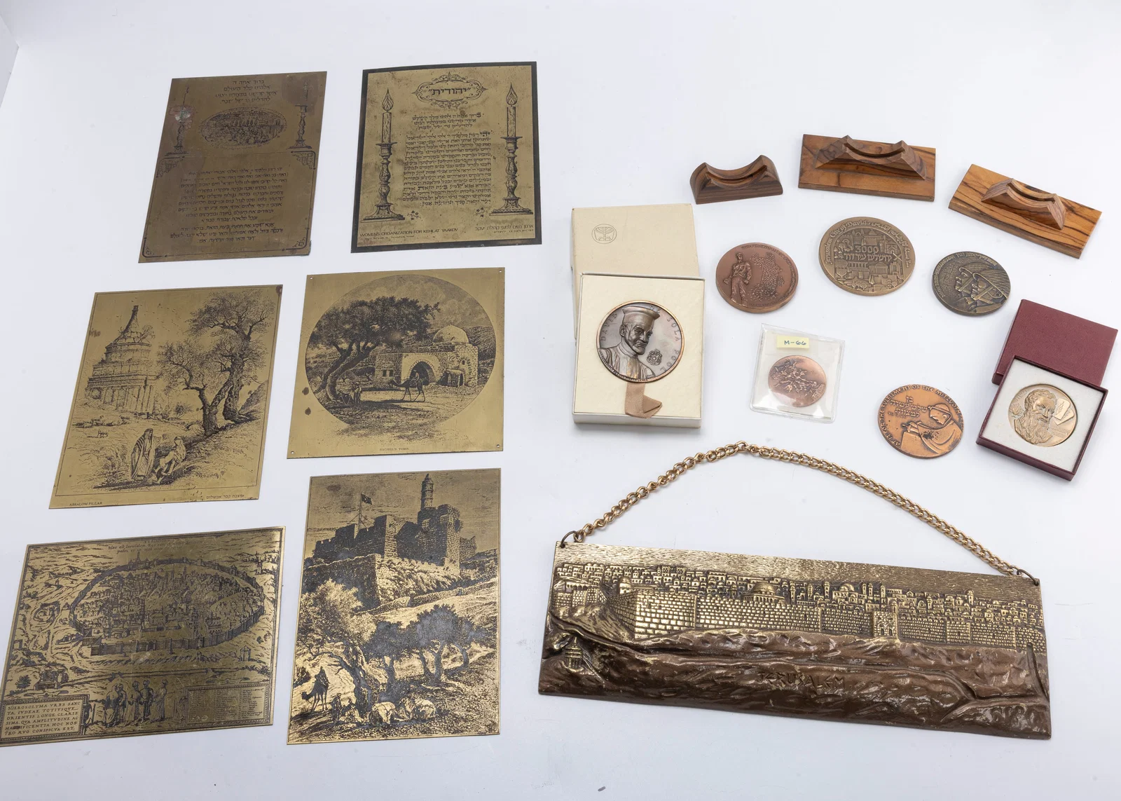 A COLLECTION OF BRASS PLAQUES AND MEDALS
