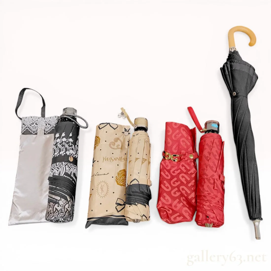 A Collection of Designer and Fashion Umbrellas Including Yves Saint Laurent Givenchy and Furla