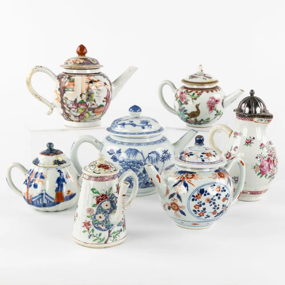 A Collection of Seven Chinese Tea and Chocolate pots, Imari, Blue and White, and Famille Rose,