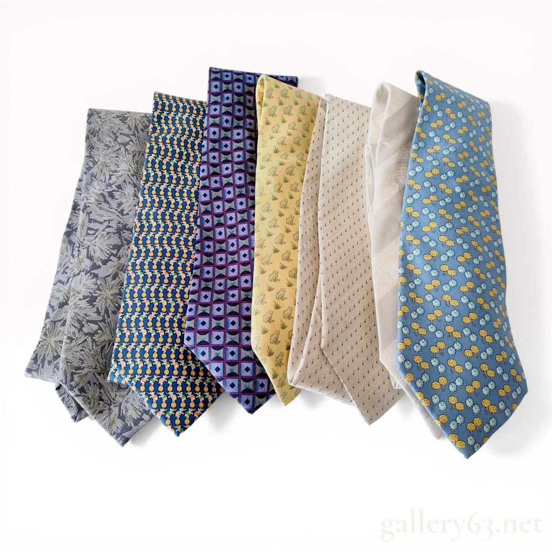 A Collection of Seven Designer Silk Neckties Including Hermes, Salvatore Ferragamo, and Burberrys