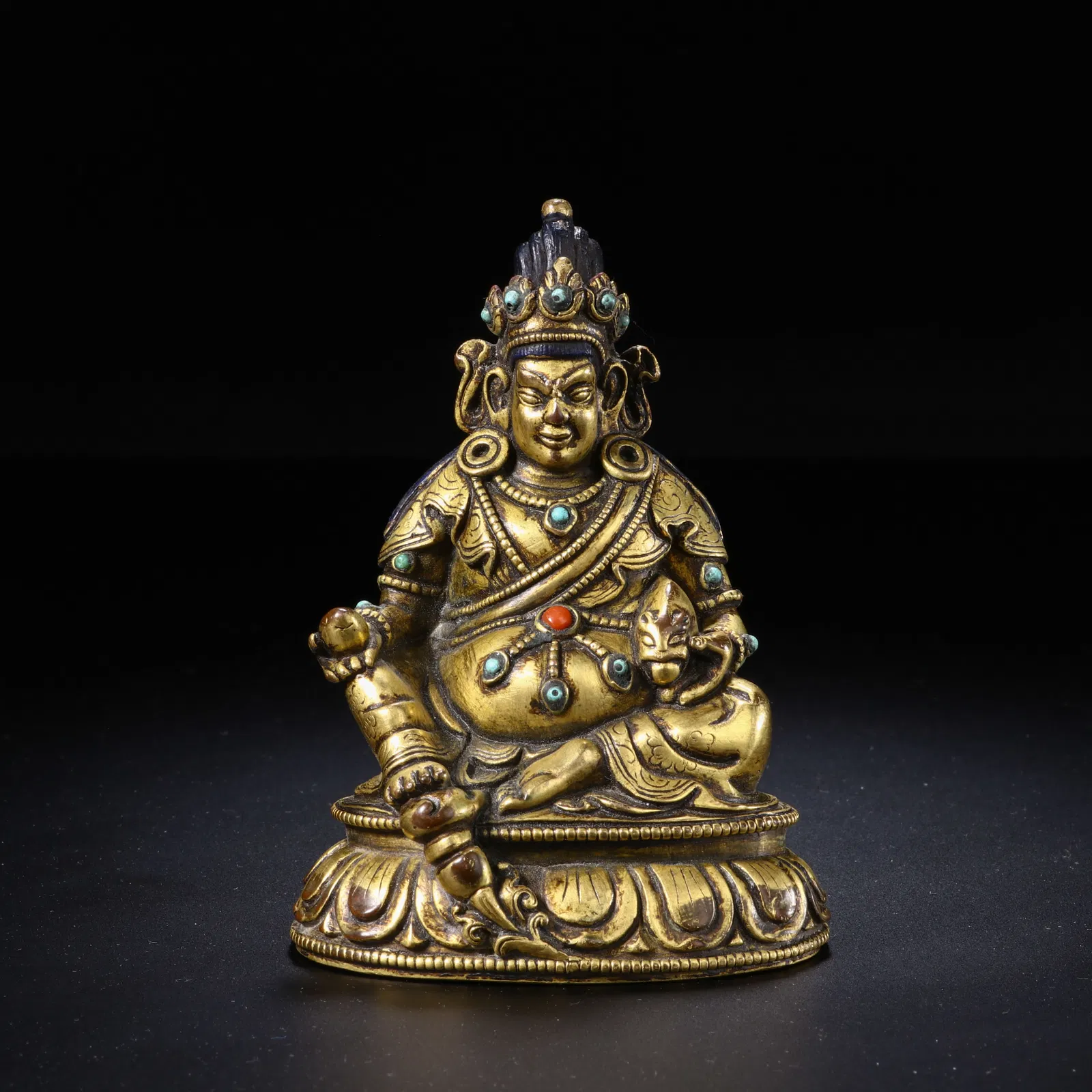 A COPPER ALLOY FIGURE OF JAMBHALA