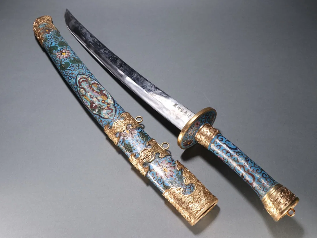 A copper-gilt cloisonn é blue dragon pattern sword from the Qing Dynasty