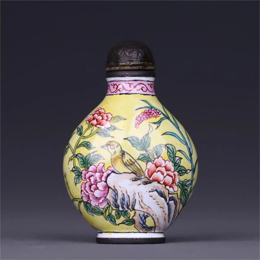 A copper tire painting enamel flower and bird pattern snuff bottle made in the Qianlong period of