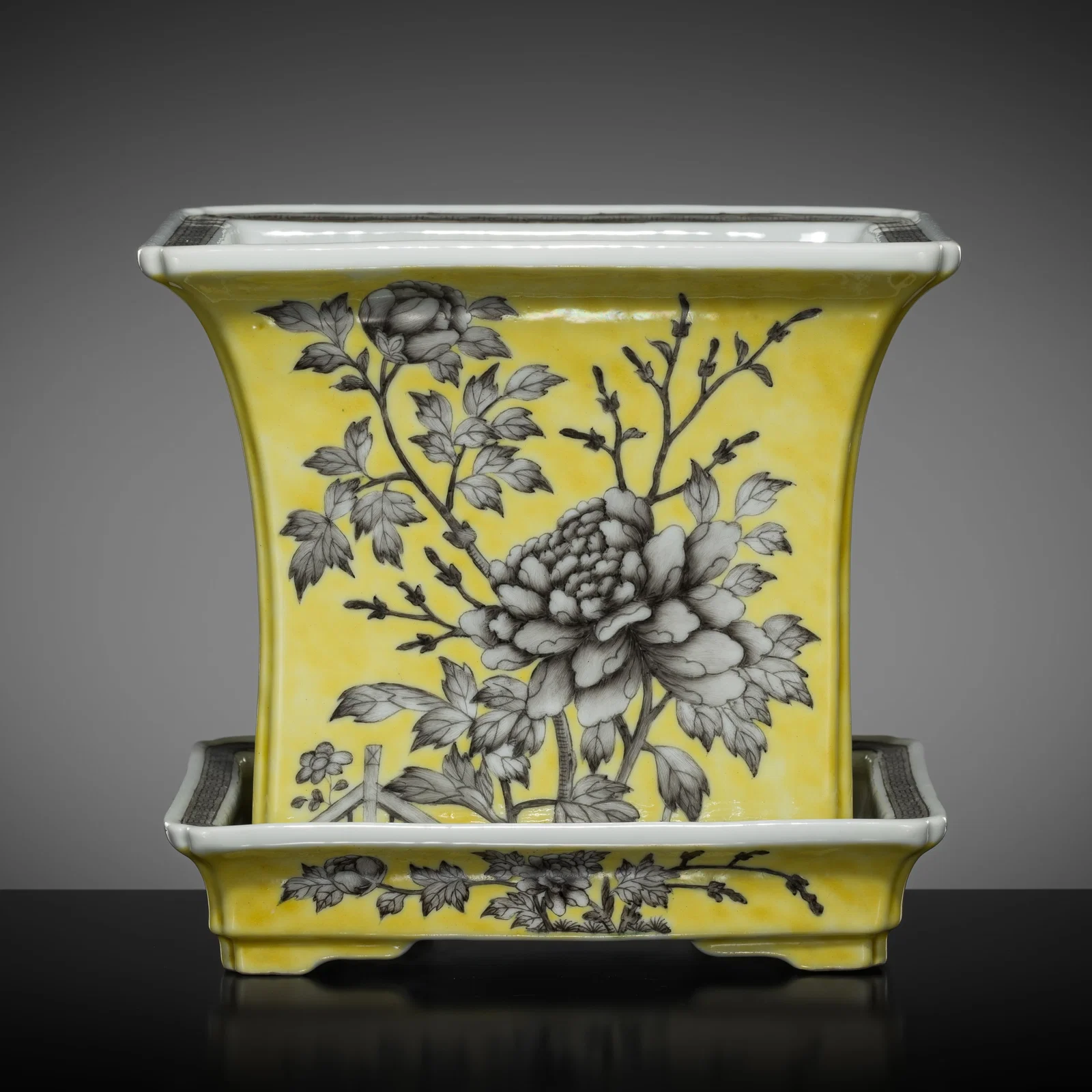 A DAYAZHAI YELLOW AND GRISAILLE 'PEONY' JARDINIÈRE AND STAND, TIHEDIAN MARK, TONGZHI TO GUANGXU