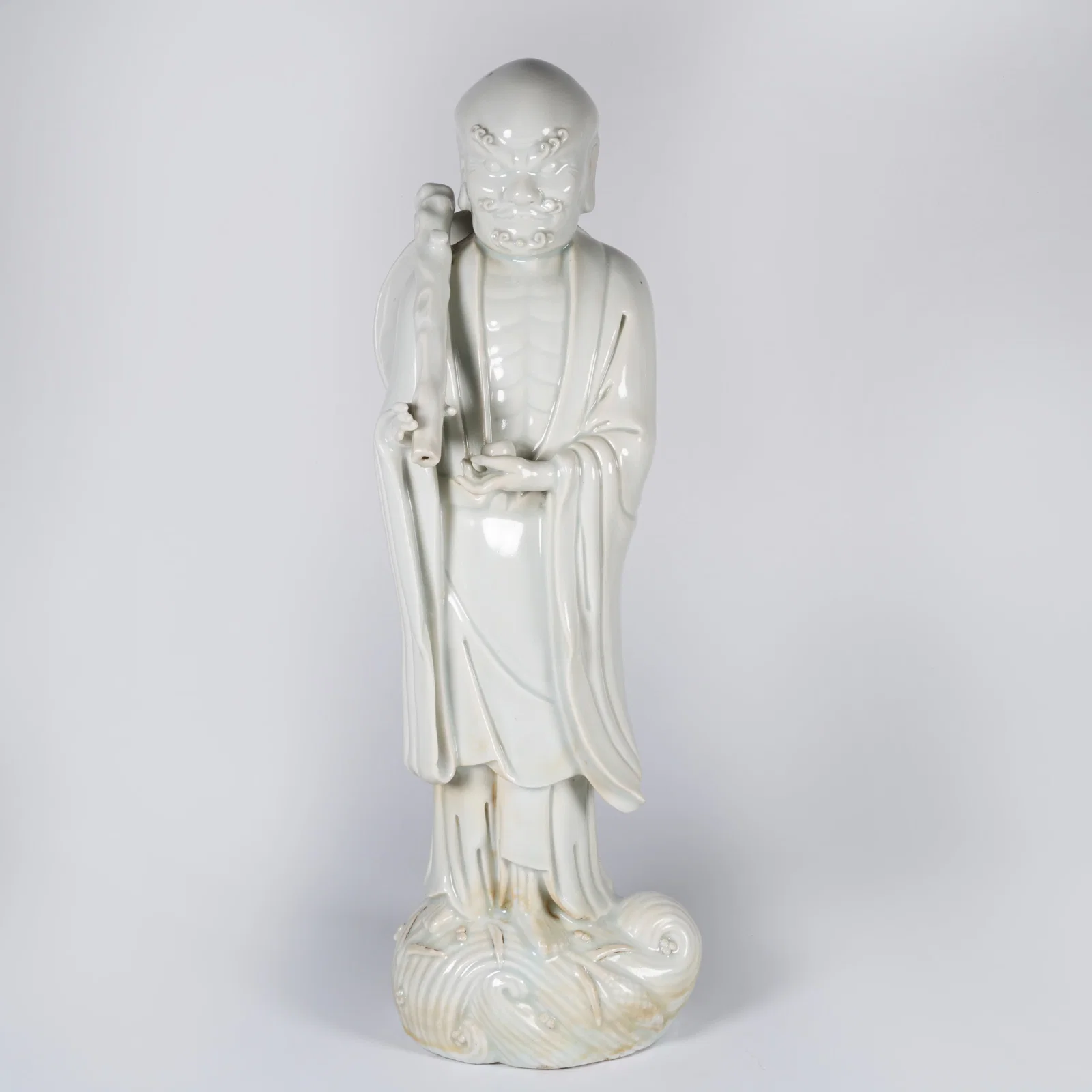 A DEHUA WHITE PORCELAIN LUOHAN STATUE