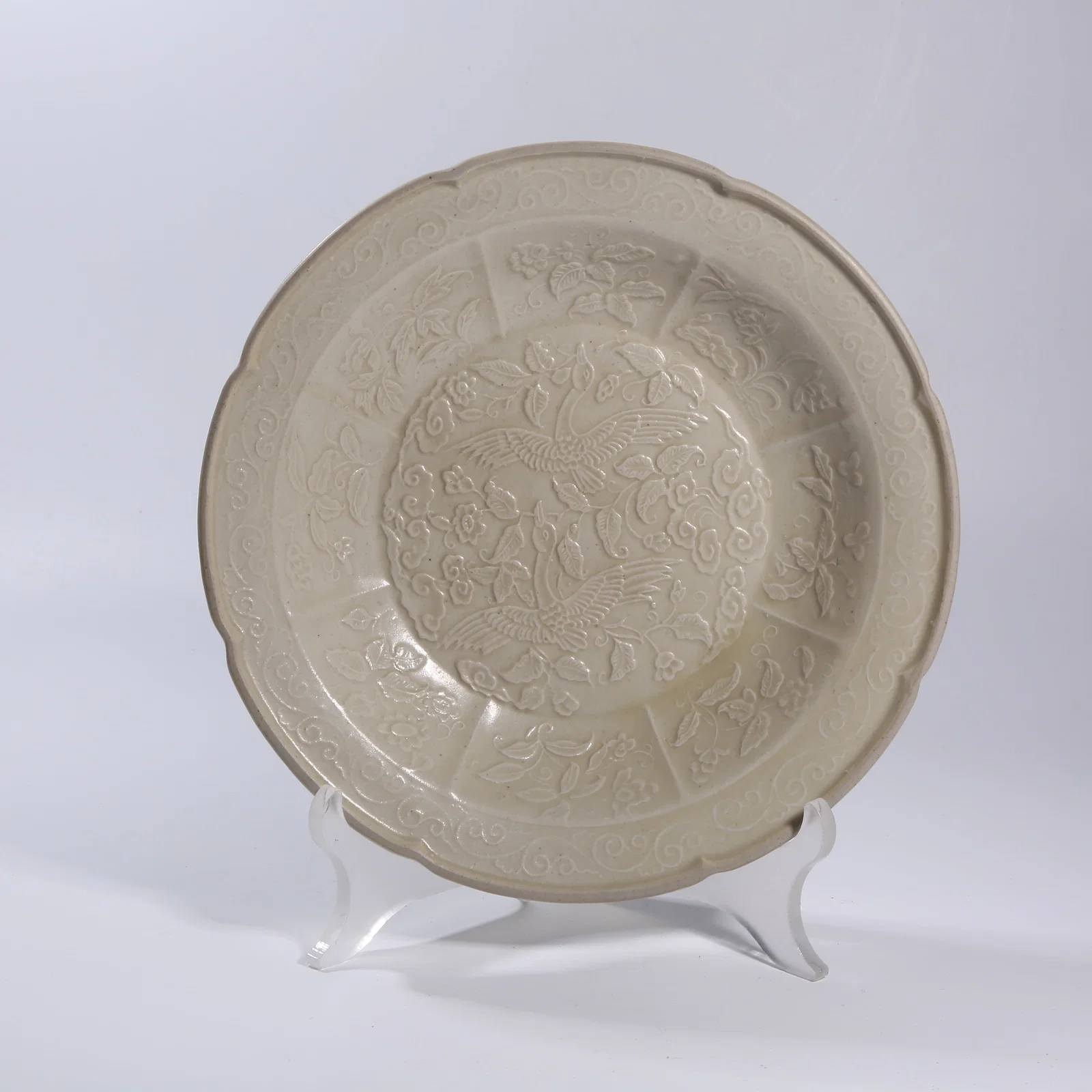 A DING KILN CARVED PIERCED PHOENIX-PATTERN DISH