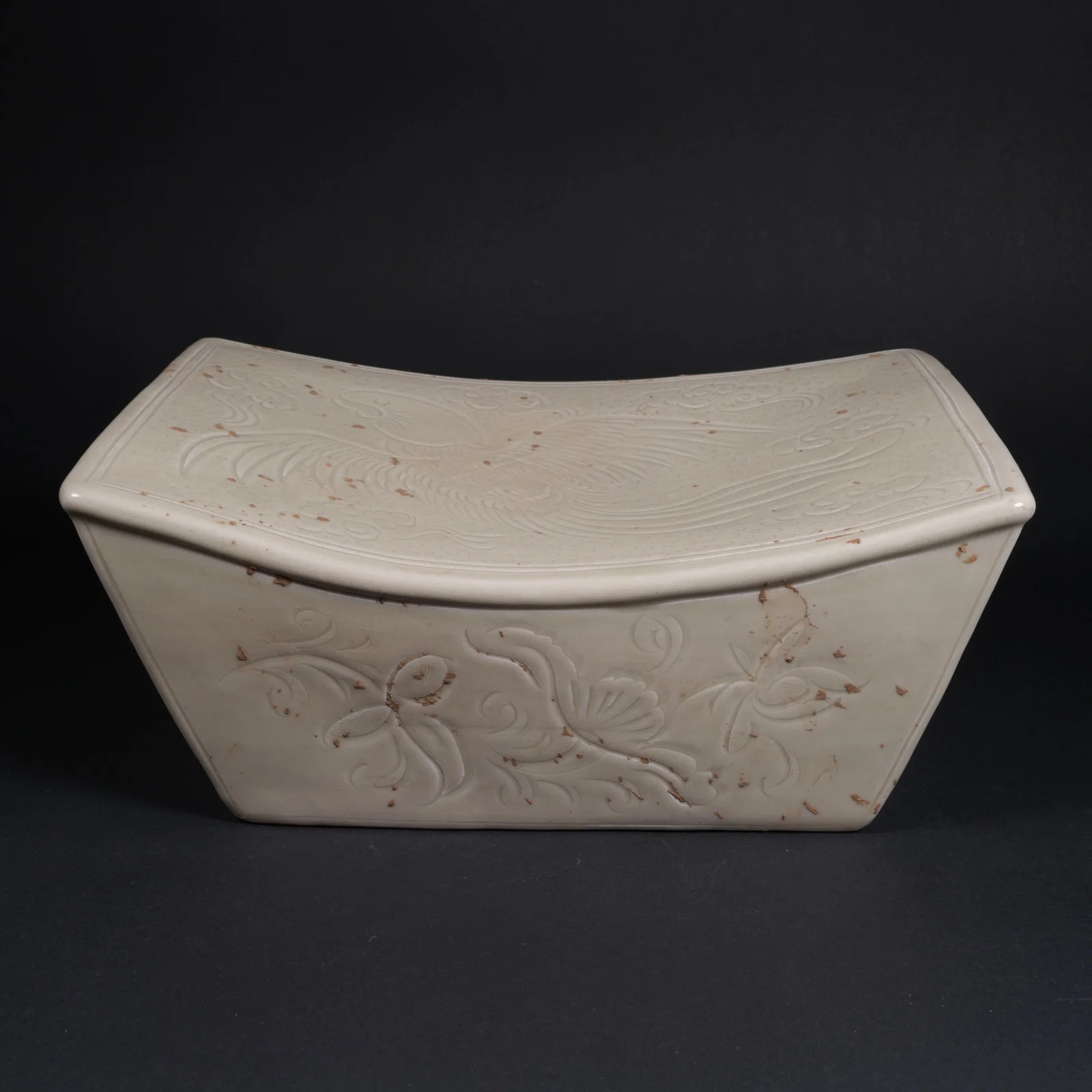 A DING WARE PORCELAIN PILLOW WITH PHOENIX MOTIF