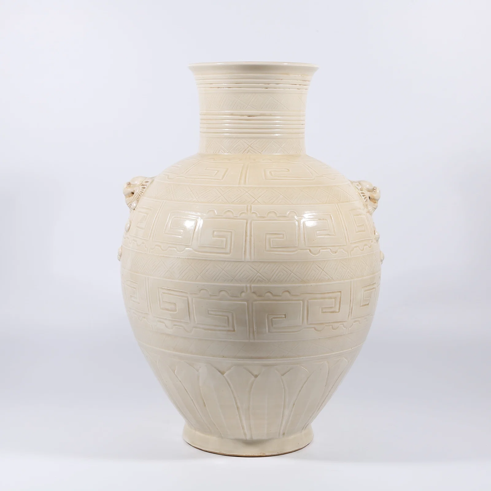 A DING WARE VASE WITH LION-HEAD HANDLES