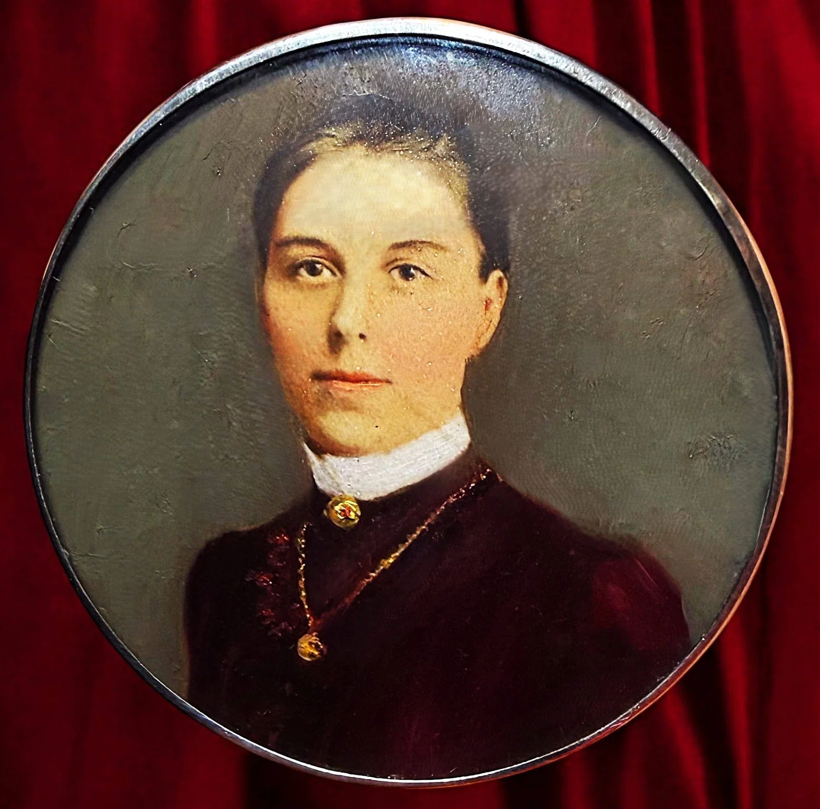 A DIVISION ONE HAND PAINTED FIGURAL BUTTON