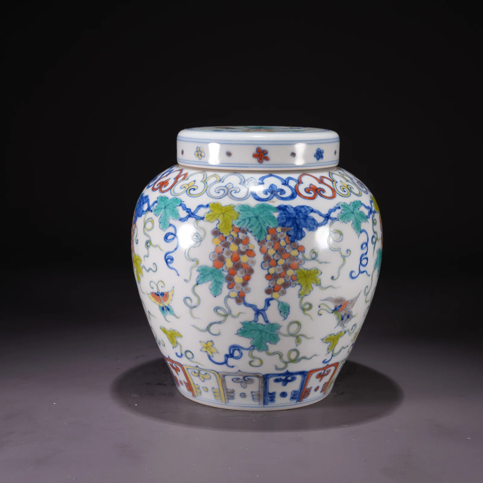 A DOUCAI JAR WITH FLORAL AND BUTTERFLY MOTIF AND "TIAN" MARK