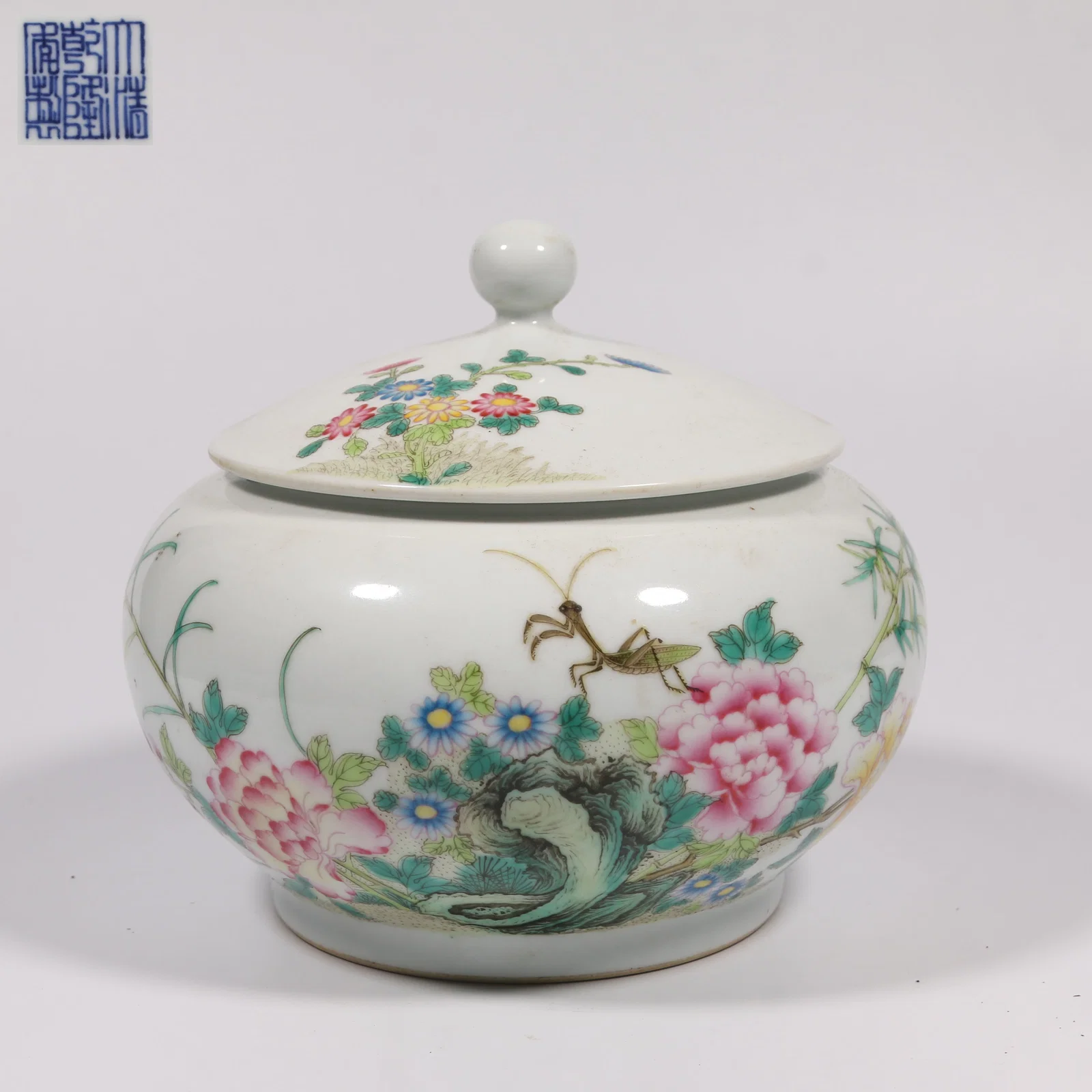 A FAMILLE ROSE "PROSPERITY IN BLOOM" COVERED JAR