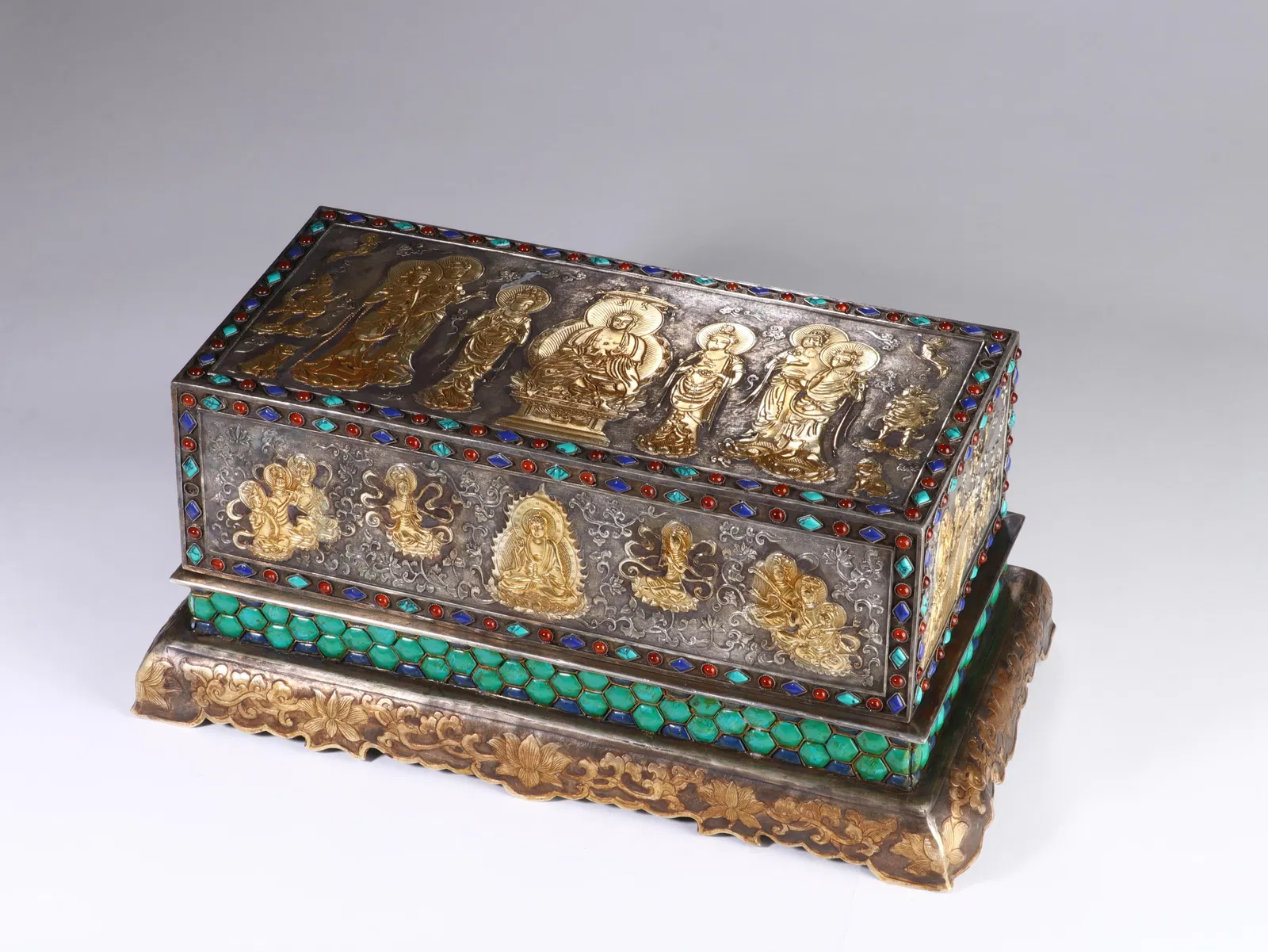 A FINE BRONZE PARTLY GILT BUDDHIST SUTRA BOX WITH COVER