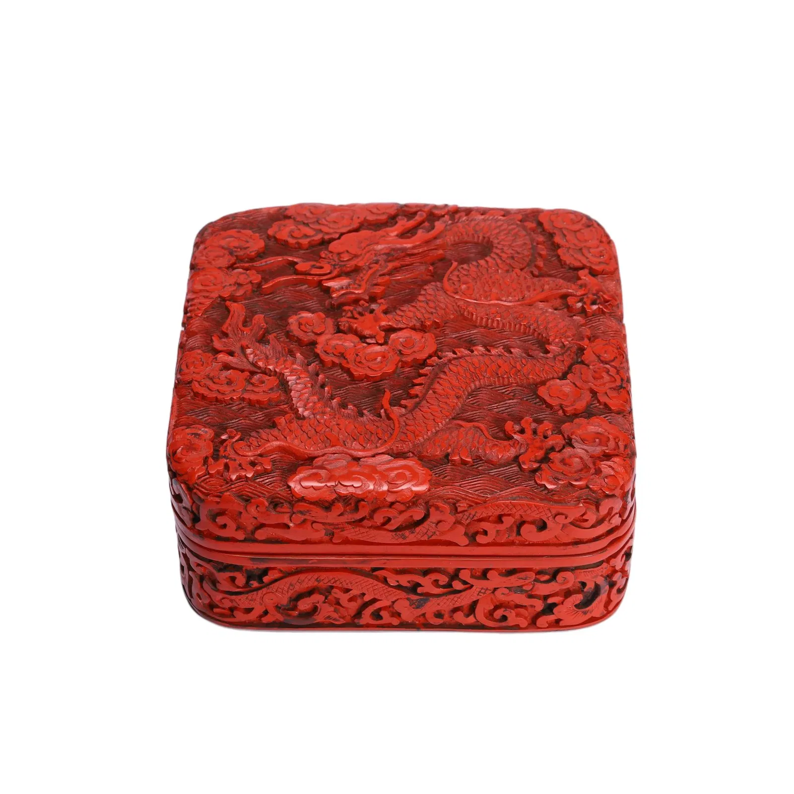 A FINE CARVED CINNABAR LACQUER DRAGON BOX WITH COVER