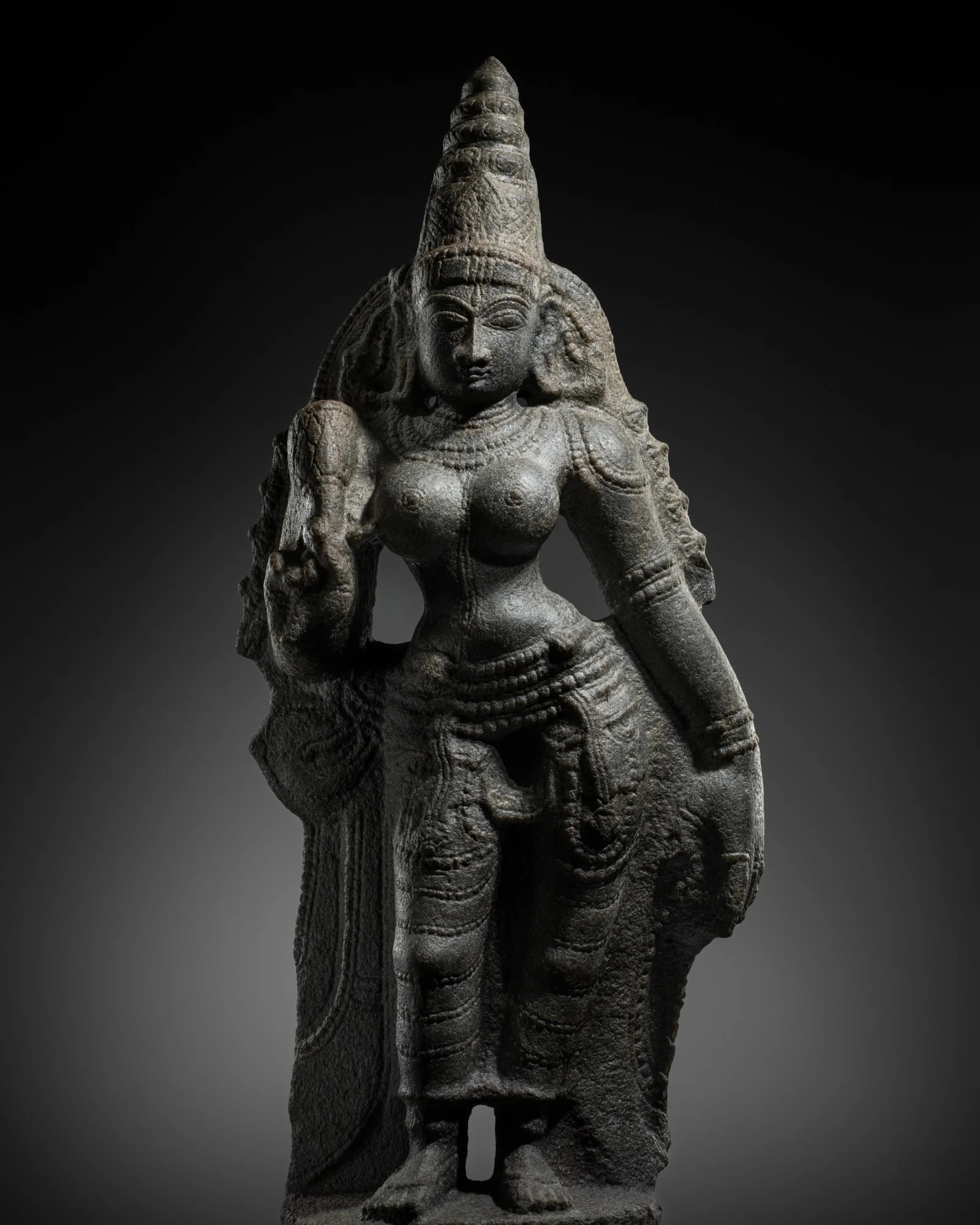 A FINE GRANITE FIGURE OF PARVATI, LATE CHOLA TO EARLY VIJAYANAGARA PERIOD, 12TH-14TH CENTURY