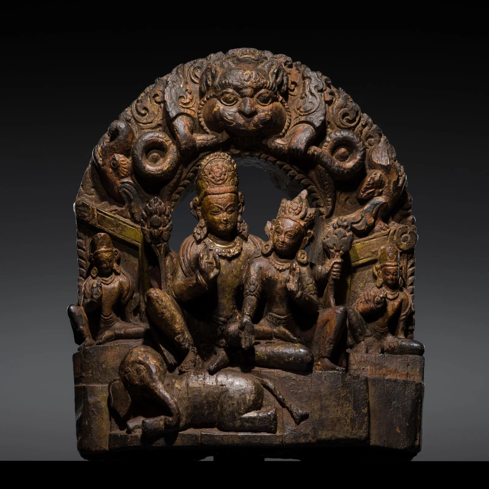 A FINE WOOD STELE OF UMAMAHESHVARA, NEPAL, 16TH-17TH CENTURY