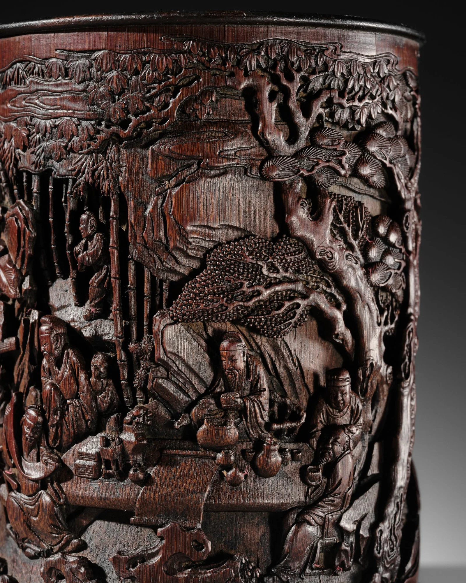 A FINELY CARVED BAMBOO 'SCHOLARS AND MUSICIANS' BRUSHPOT, BITONG, LATE 17TH - 18TH CENTURY