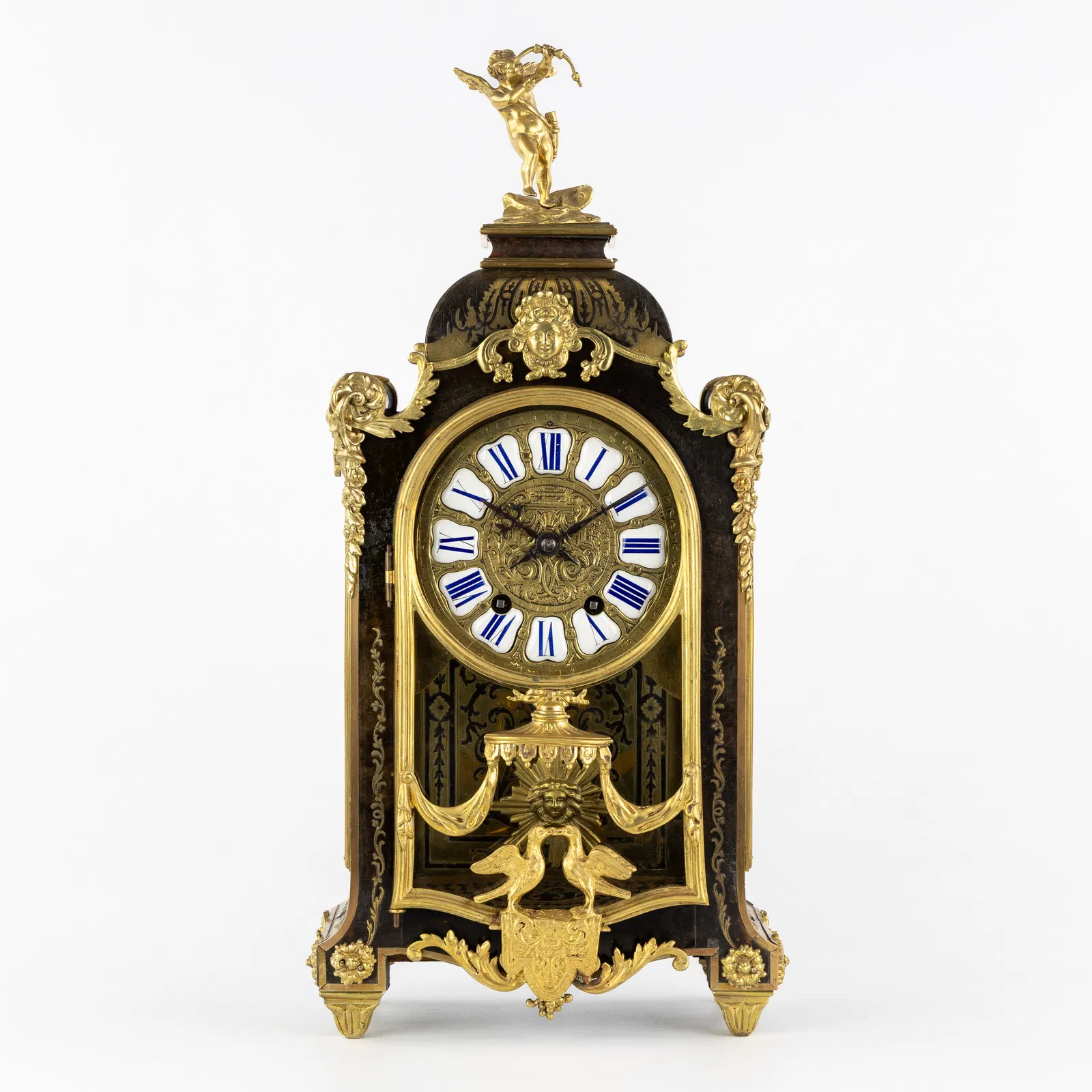 A French Cartel clock, Boulle inlay, richly mounted with gilt bronze and Cupid, 19th C.