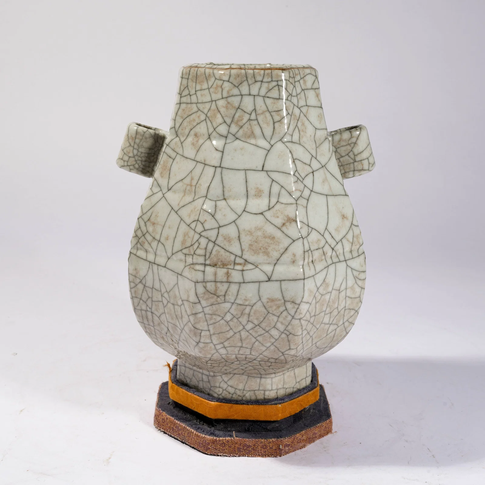 A GE KILN EIGHT-LOBED BOTTLE WITH PIERCED HANDLES