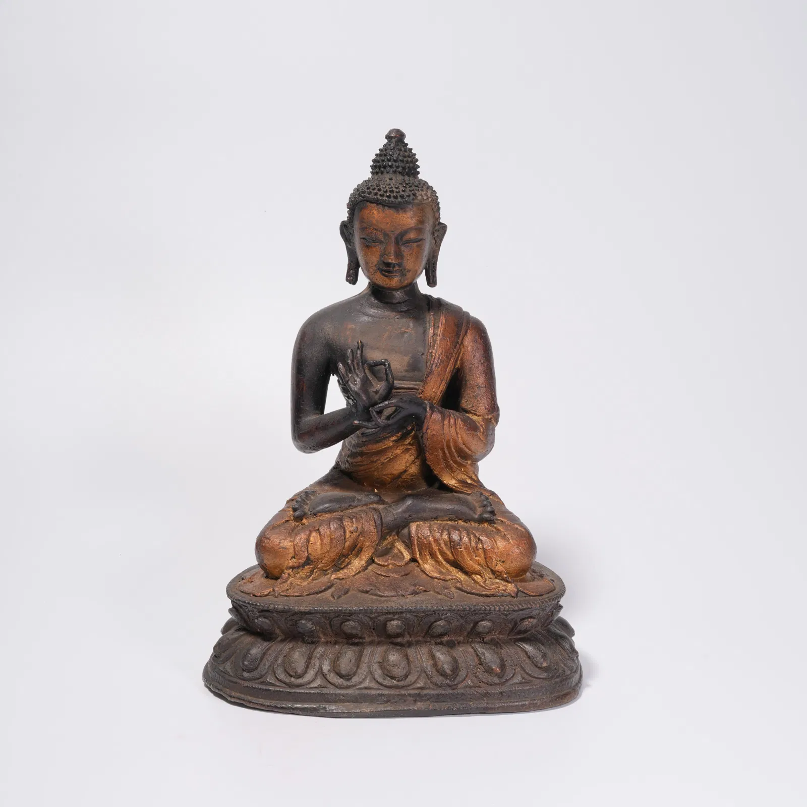 A GILDED BRONZE BUDDHA STATUE (PARTIAL)