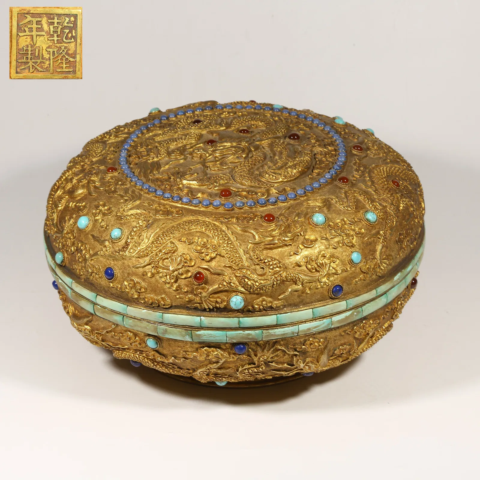 A GILDED BRONZE COVERED BOX INLAID WITH GEMSTONES, CLOUD AND DRAGON PATTERN