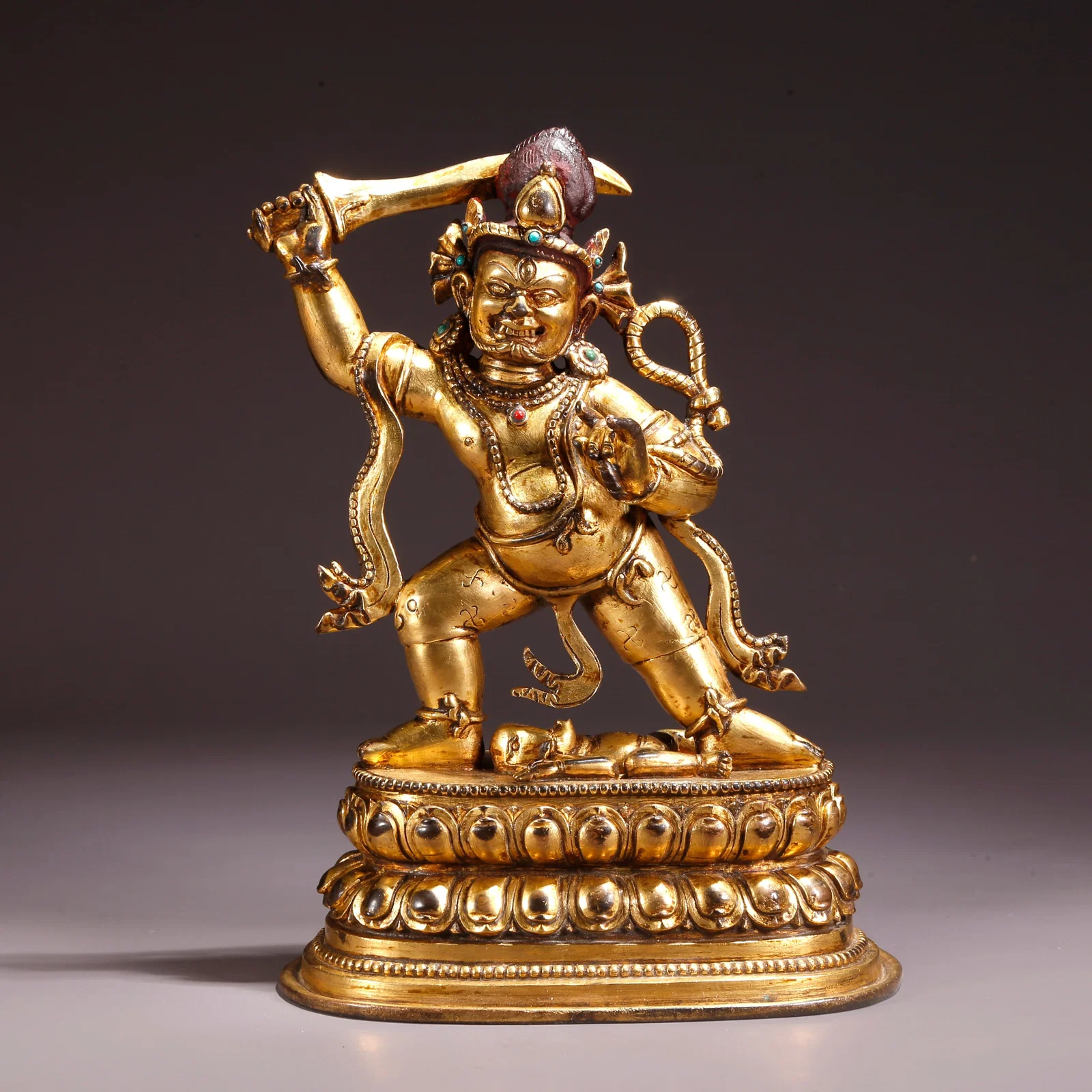 A GILDED BRONZE FUDO MYO-O STATUE