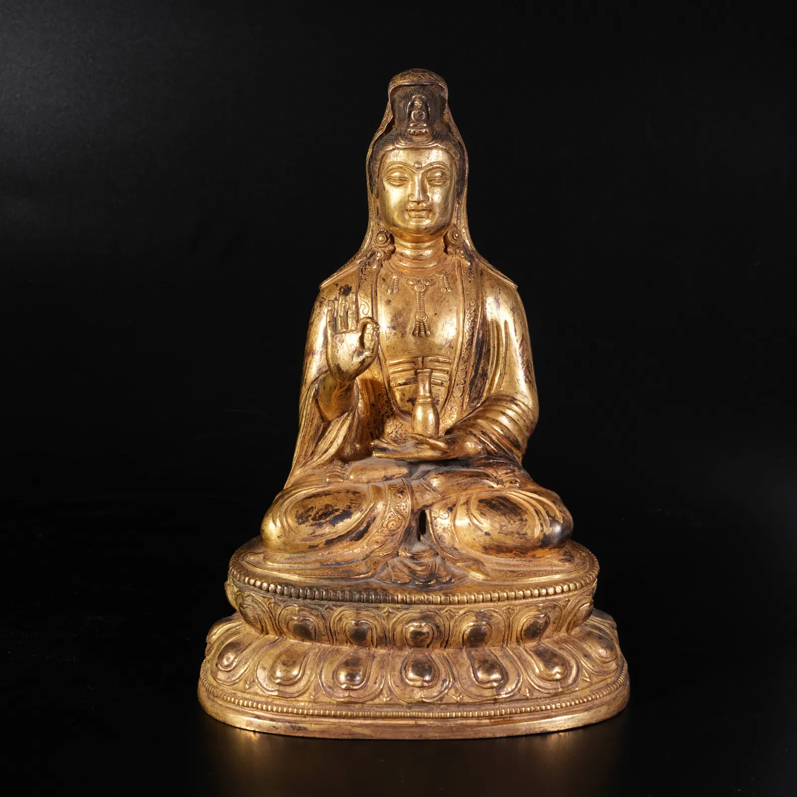 A GILDED BRONZE GUANYIN STATUE
