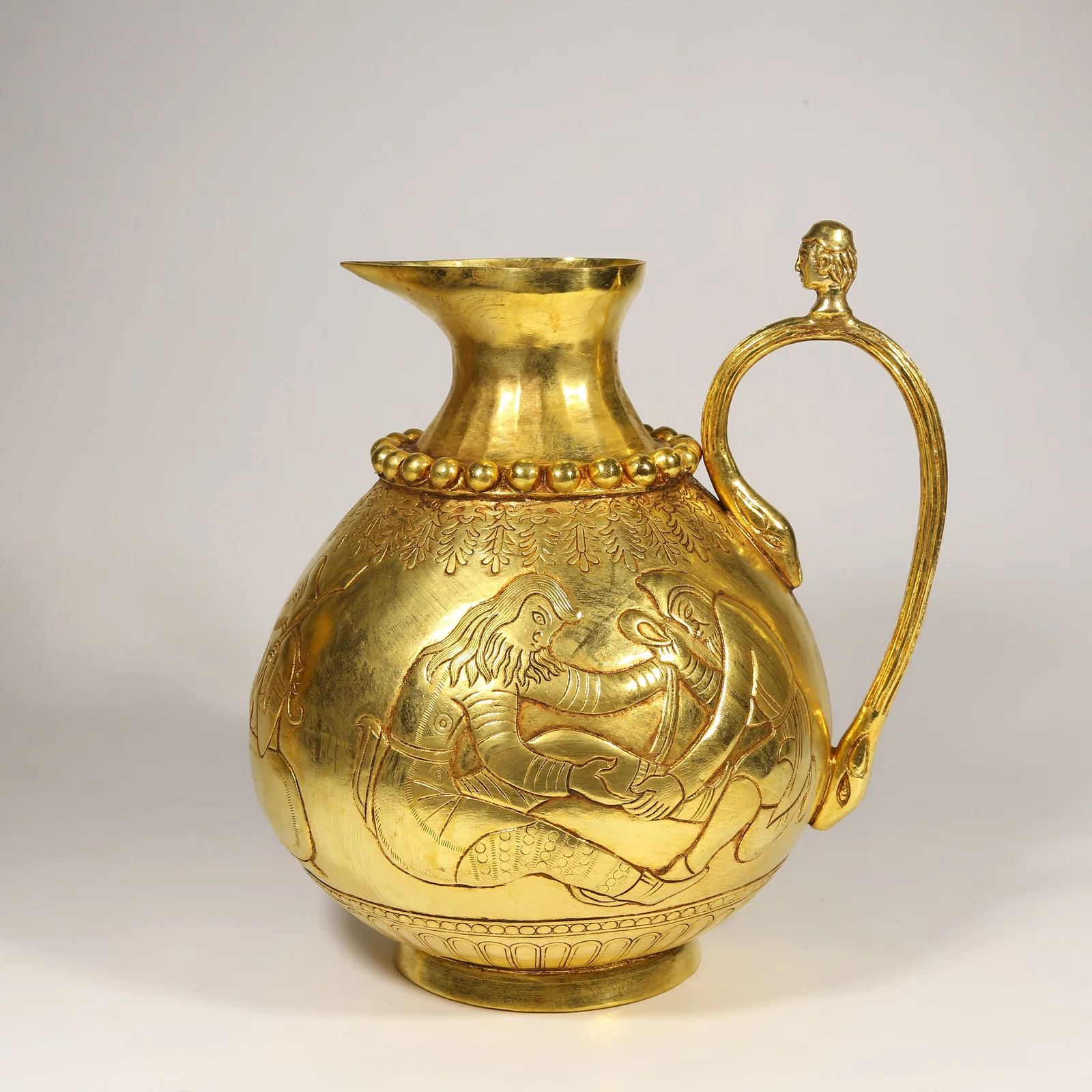 A GILDED BRONZE PERSIAN POT WITH FIGURES PATTERN