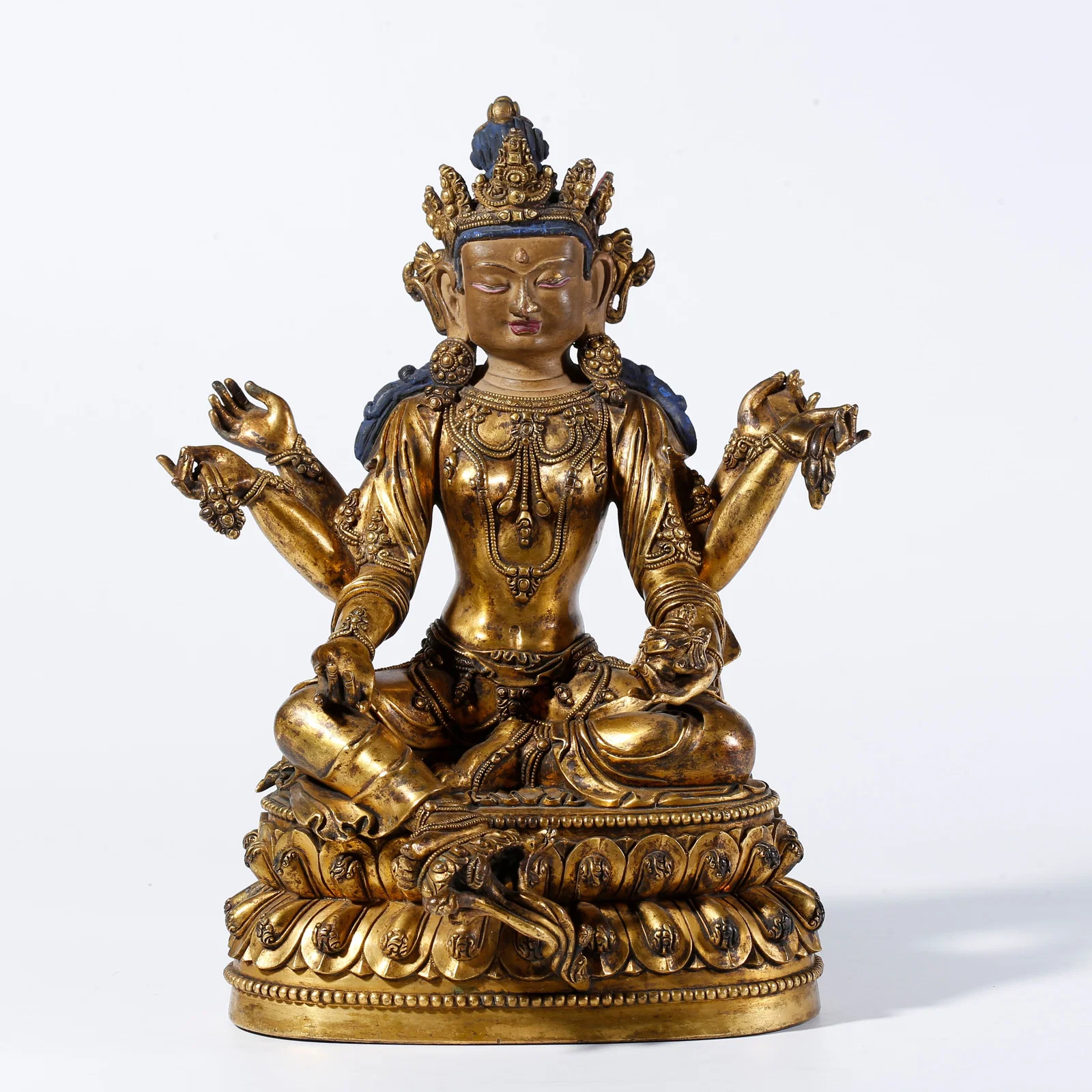 A GILDED BRONZE SIX-ARMED AVALOKITESHVARA STATUE