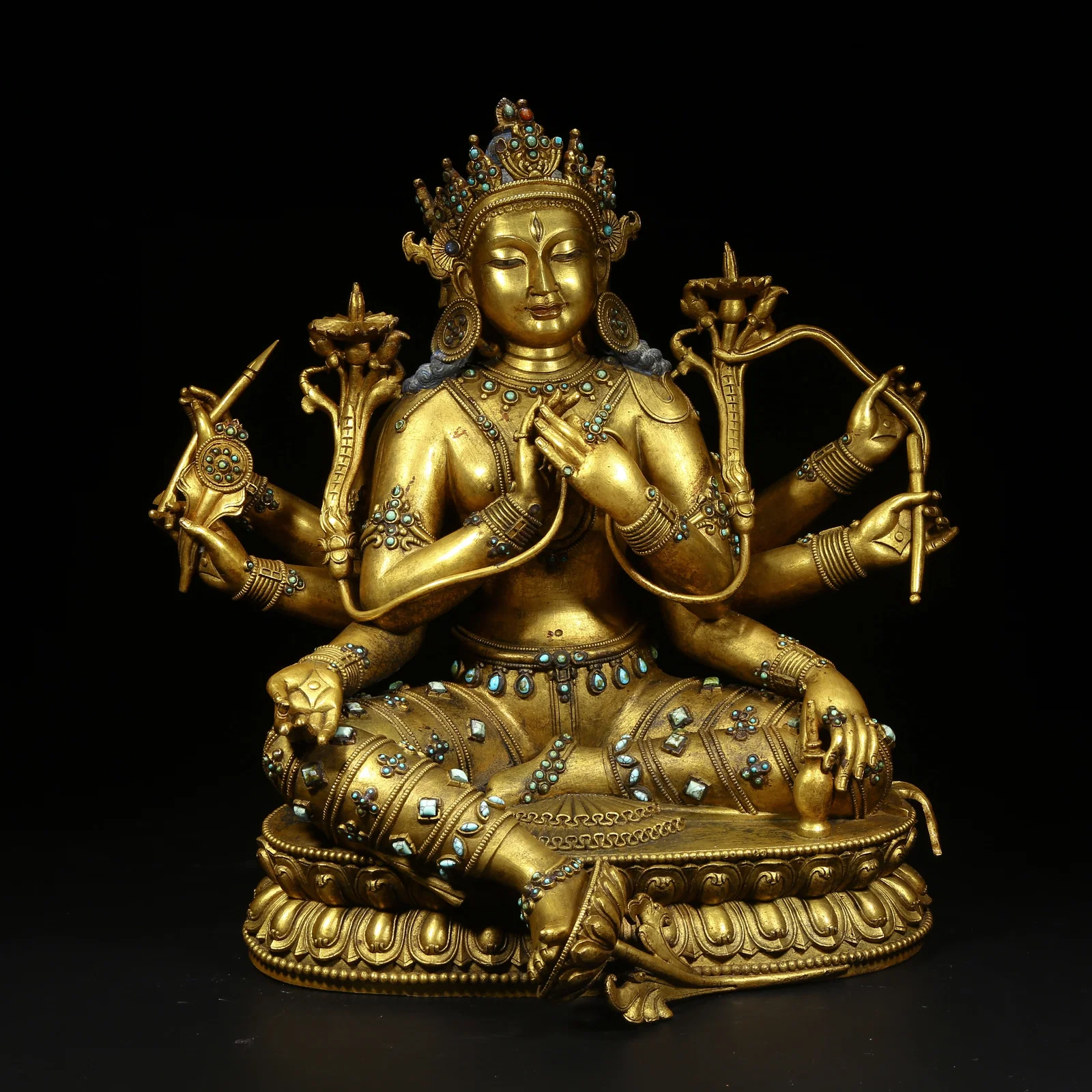 A GILDED BRONZE STATUE OF VAJRAVARAHI INLAID WITH TURQUOISE