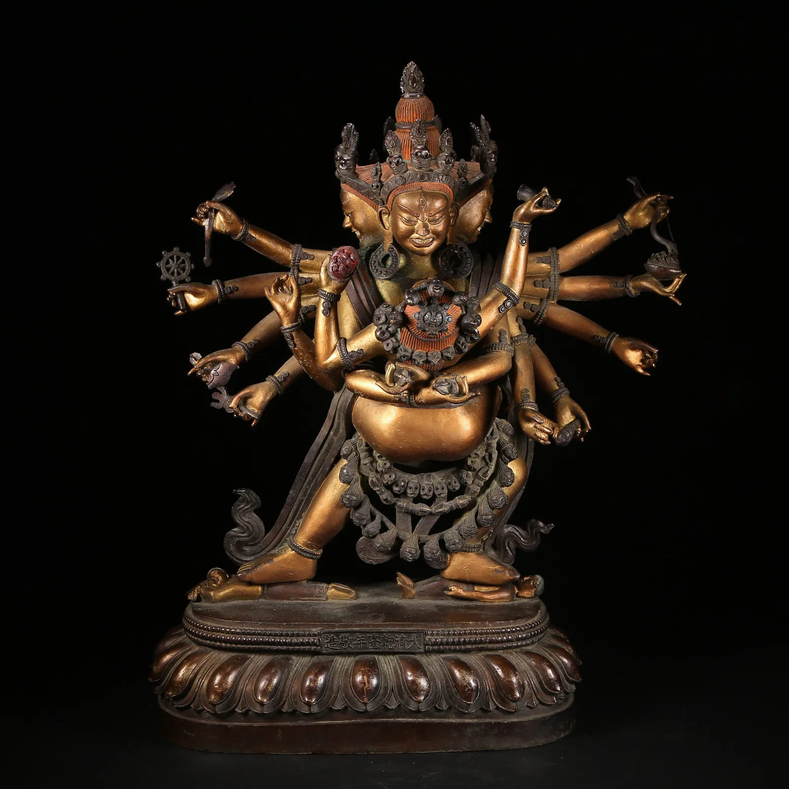 A GILT AND BRONZE ALLOY SIX-TIERED BUDDHIST TOWER STYLE SHIVALOKA VAJRA STATUE