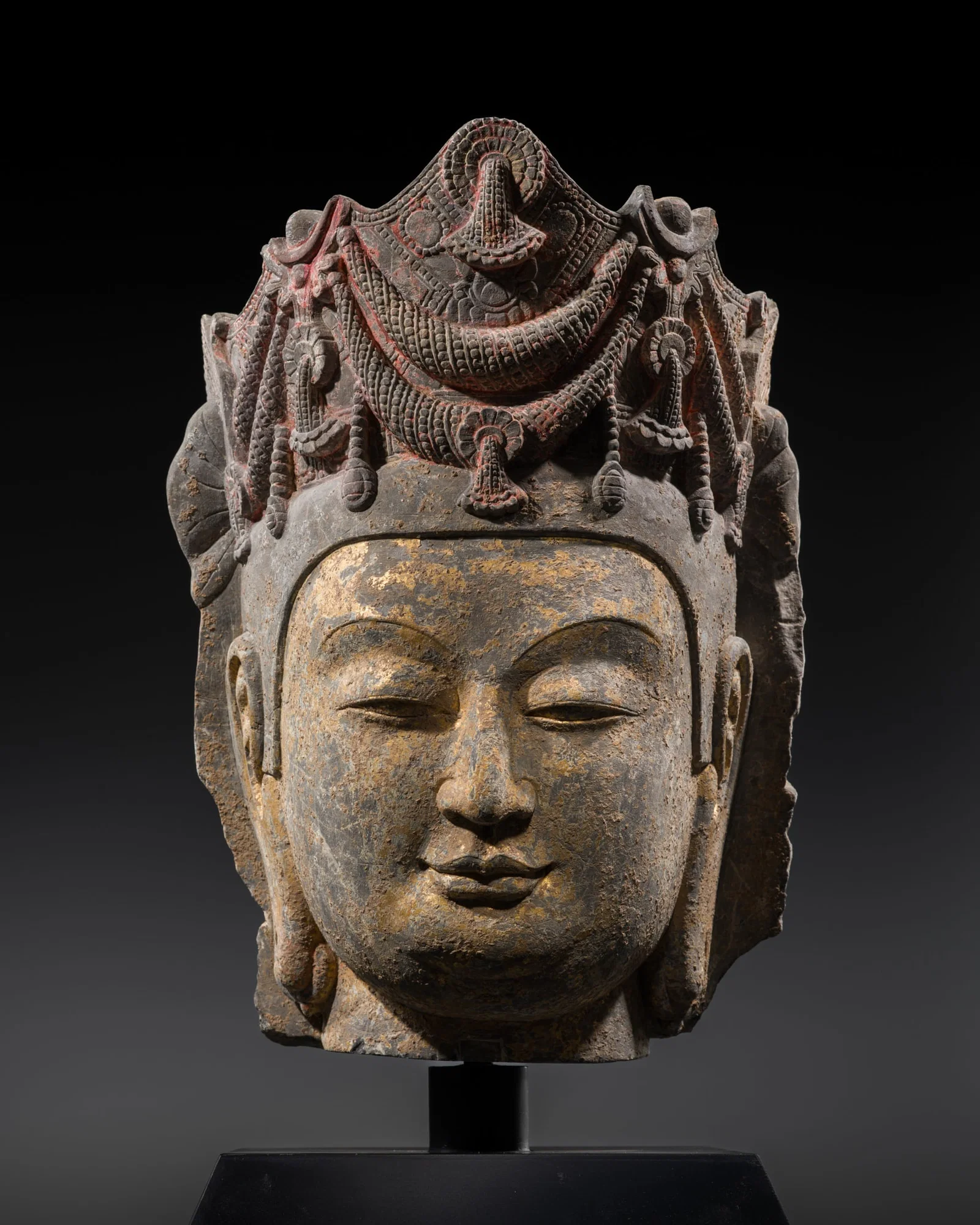 A GILT AND POLYCHROME LIMESTONE HEAD OF A BODHISATTVA, SUI DYNASTY