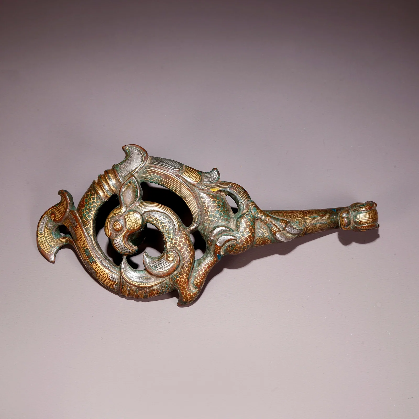 A GILT AND SILVER INLAID BRONZE DRAGON-AND-PHOENIX BELT HOOK