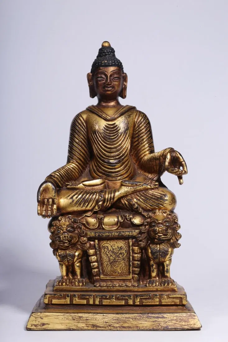 A Gilt Bronze Acala Buddha Statue
