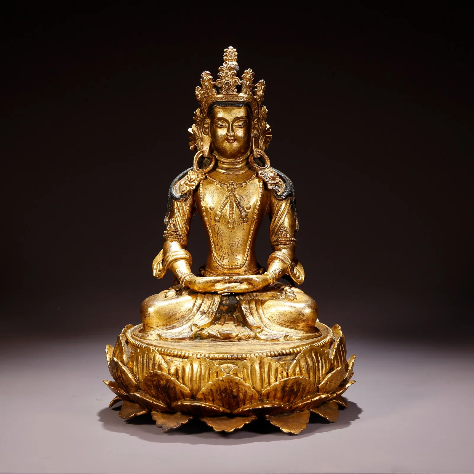 A GILT-BRONZE AMITAYUS (INFINITE-LIFE BUDDHA) FIGURE