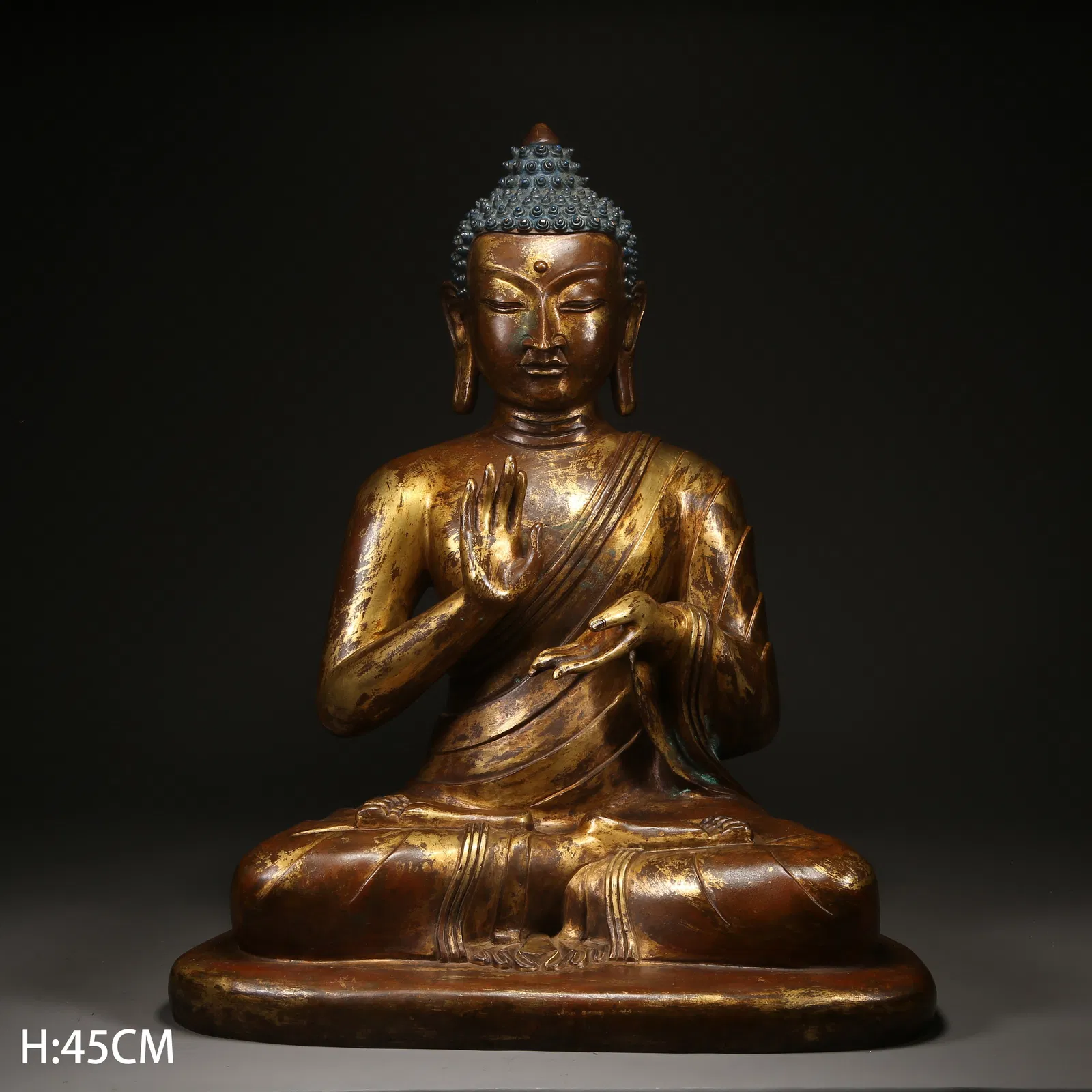 A GILT BRONZE AMOGHASIDDHI BUDDHA STATUE