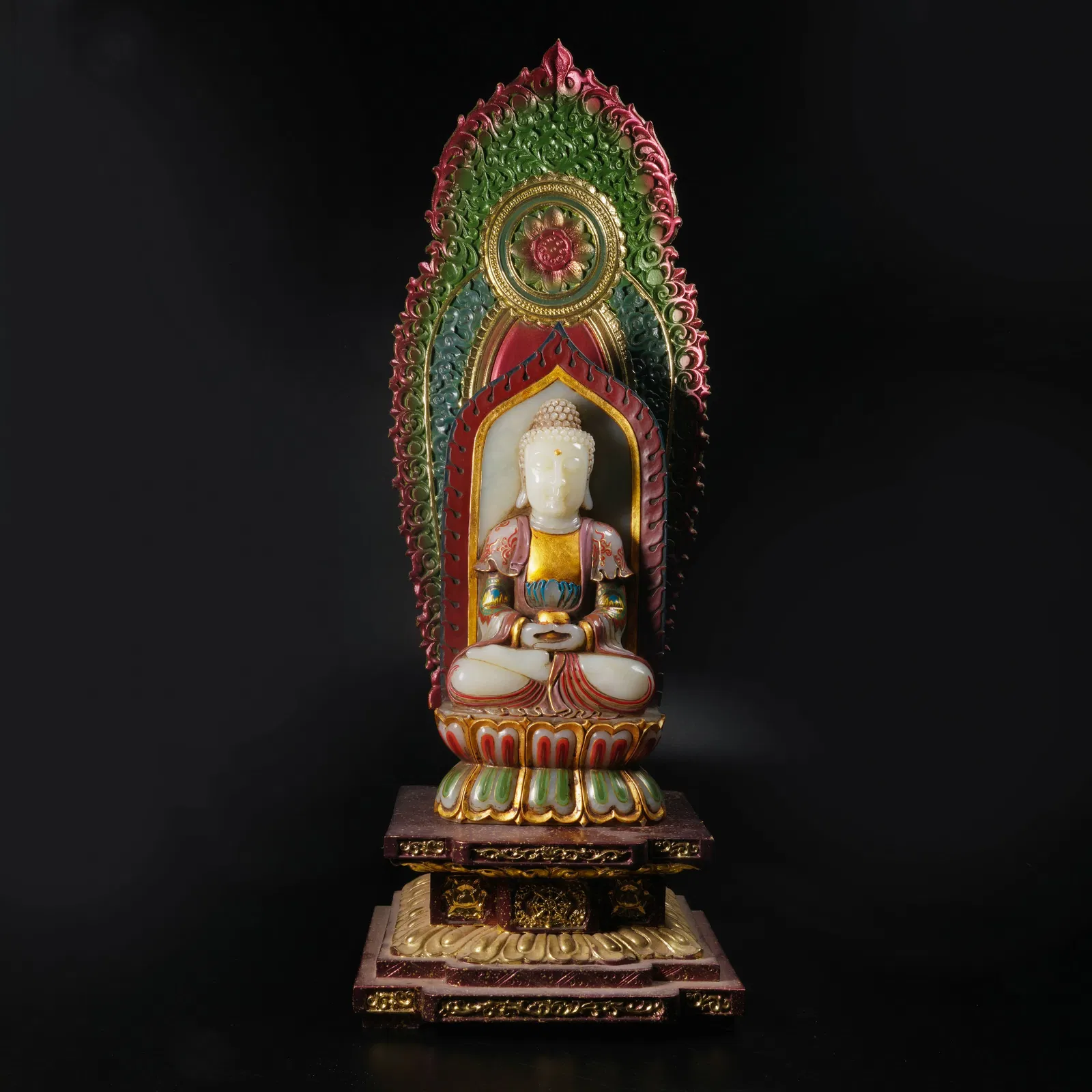 A GILT-BRONZE AND ENAMEL STATUE OF MEDICINE BUDDHA INLAID WITH HETIAN WHITE JADE