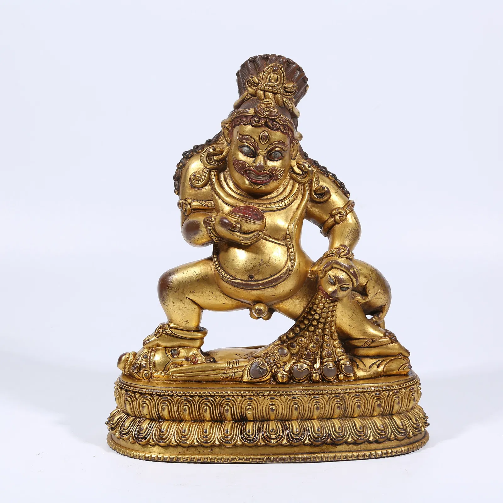 A GILT BRONZE BLACK JAMBHALA STATUE