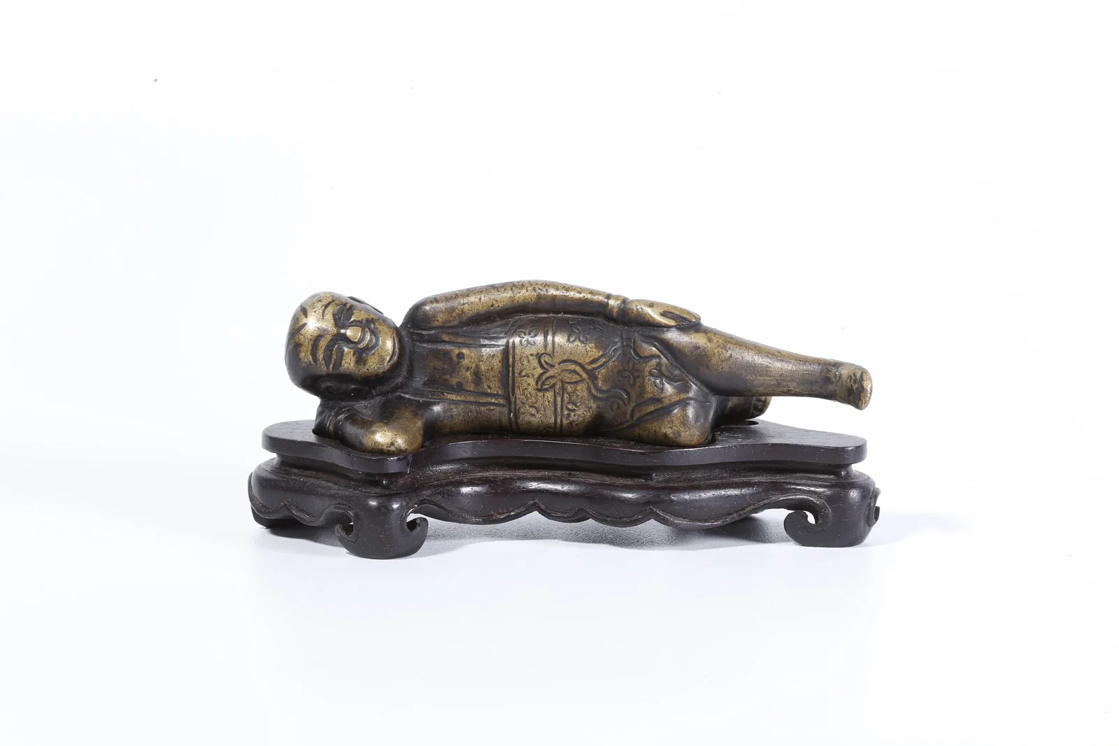 A GILT BRONZE CHILD-SHAPED ORNAMENT